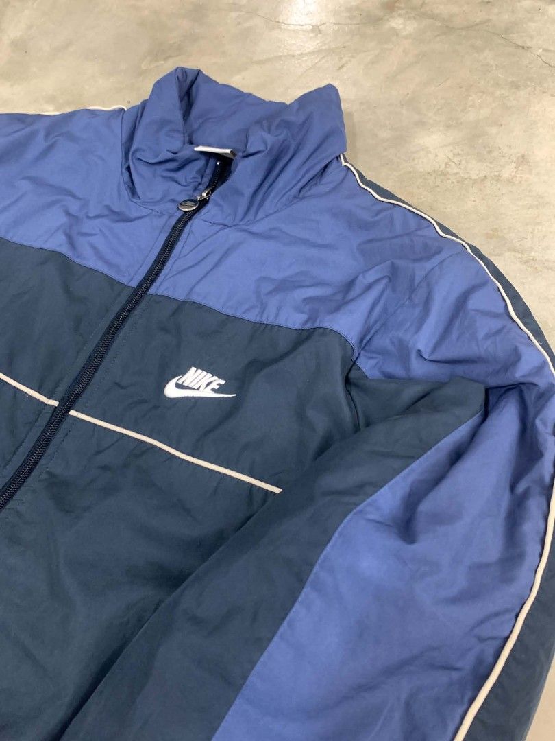 Nike Windbreaker Jacket Blue Dark Blue (Category: Coats, Jackets and Outerwear) located in Manila. Submitted by rodeltzy (Listing ID 1461983954, Image 2). Description: - Classic Nike windbreaker - Two-tone blue and dark blue colorway - White piping detail on chest and sleeves - Elasticated cuffs and hem with drawstring - Full zip closure - Ideal for everyday wear or light workouts.