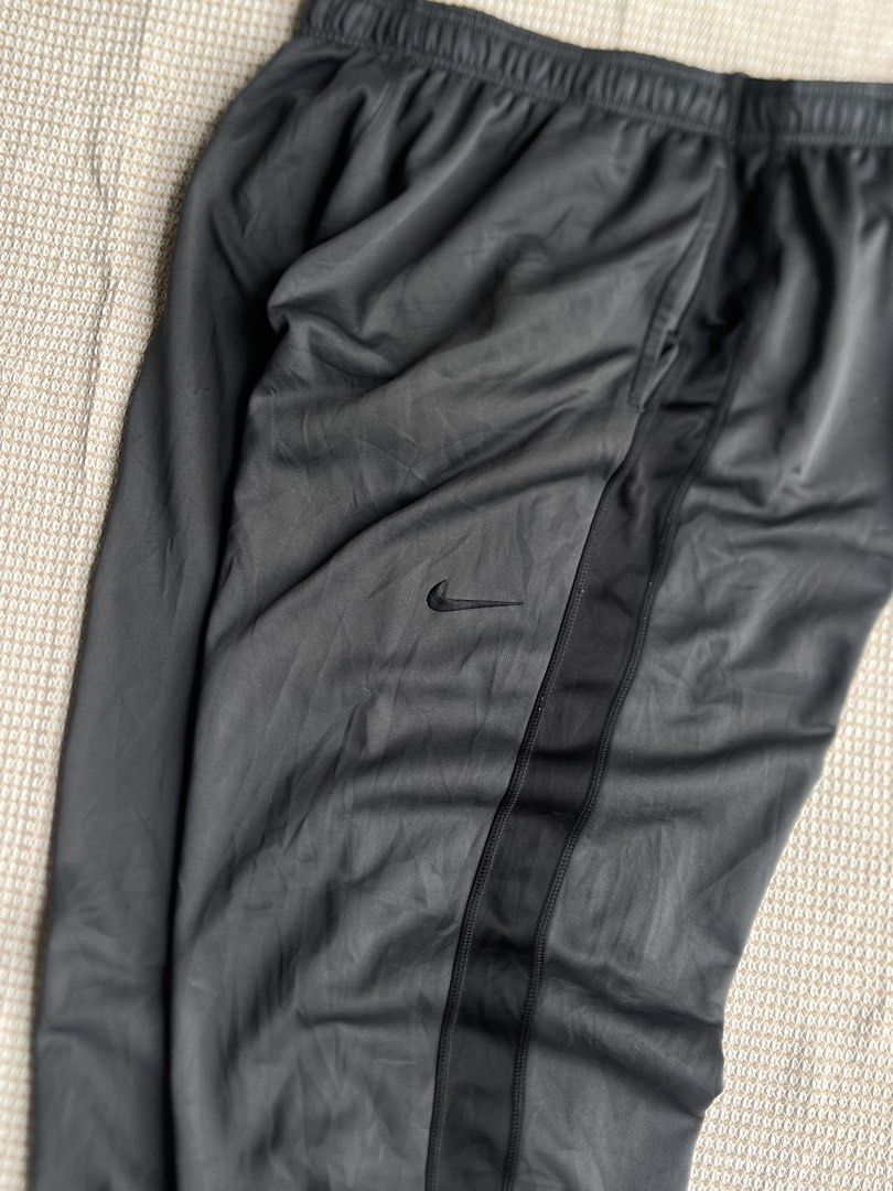 Nike Y2K Sweat Pants (Category: Joggers) located in Santa Barbara. Submitted by keldude (Listing ID 1462005792, Image 3). Description: Nike Y2K Sweat Pangs Charcoal Grey Dimes: 36-46 Waist | 42 Length | 16 Thigh | Adjustable Hem Excellent Condition 10/10 Color Rate Issue: Minor Pinhole .
