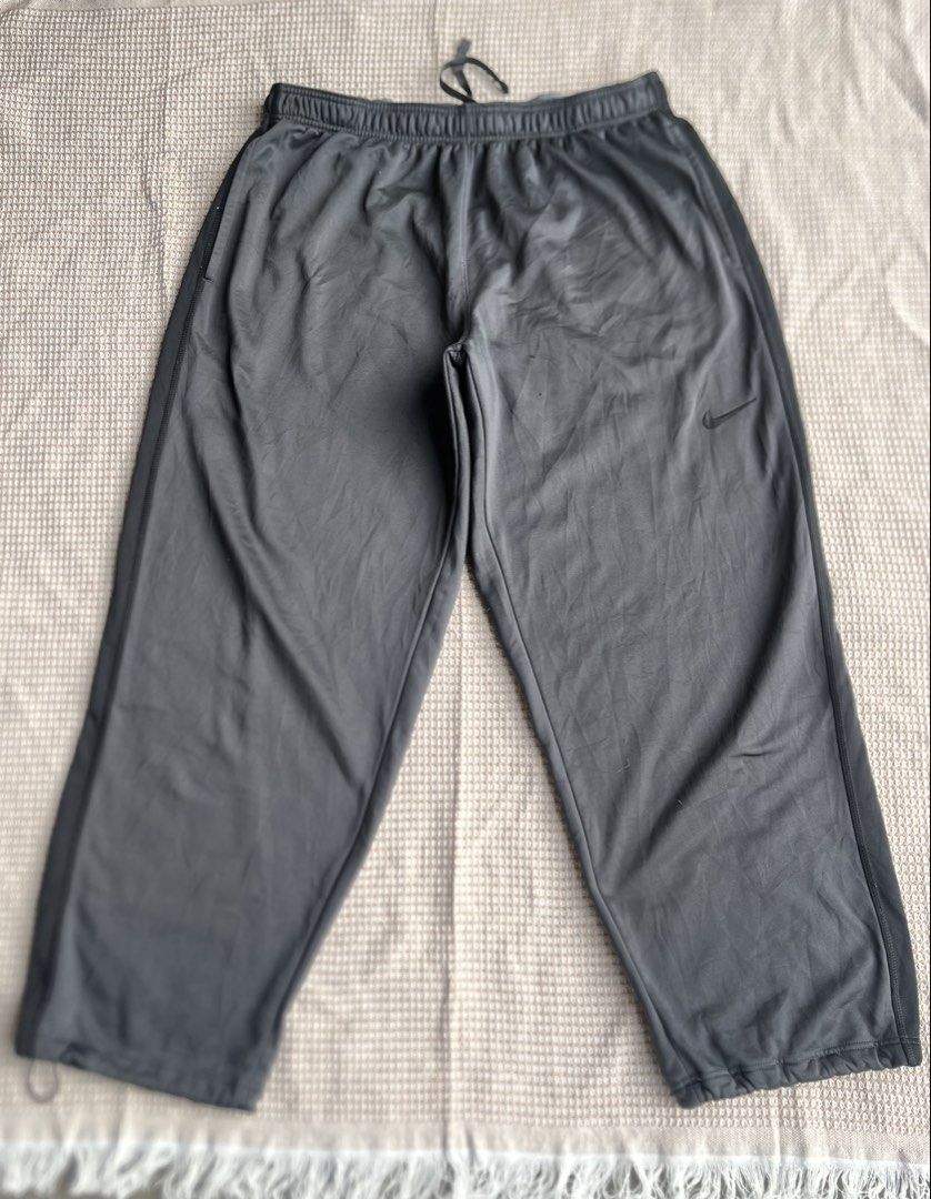 Nike Y2K Sweat Pants (Category: Joggers) located in Santa Barbara. Submitted by keldude (Listing ID 1462005792, Image 1). Description: Nike Y2K Sweat Pangs Charcoal Grey Dimes: 36-46 Waist | 42 Length | 16 Thigh | Adjustable Hem Excellent Condition 10/10 Color Rate Issue: Minor Pinhole .