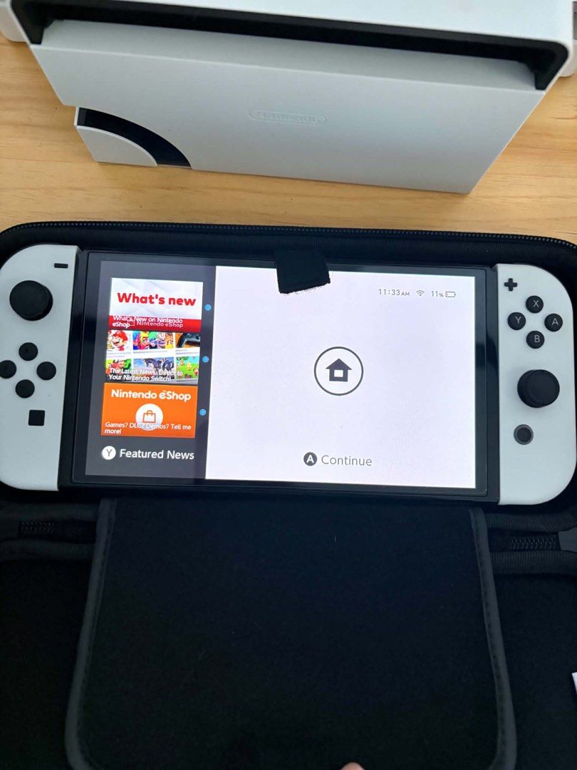 Nintendo Switch OLED Model White with TomoDachi Life Game (Category: Nintendo) located in Manila. Submitted by salandanan27716 (Listing ID 1461972778, Image 2). Description: - Nintendo Switch OLED Model (White) - Original box and packaging included - Comes with TomoDachi Life: Living the Dream game - Ready for immediate enjoyment.