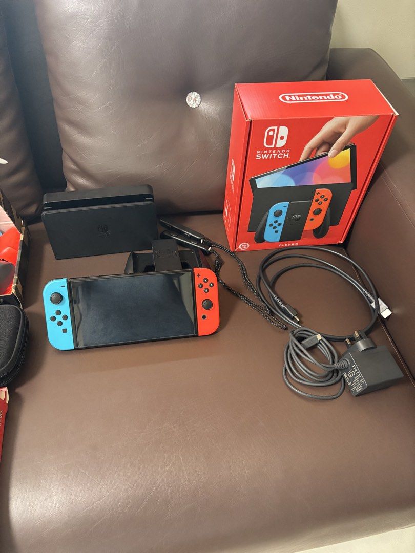 Nintendo Switch OLED w accessories (Category: Nintendo) located in Cavite. Submitted by mjalucero (Listing ID 1462018335, Image 2). Description: ‼️FOR SALE ONLY‼️ Nintendo Switch OLED Includes (all original): - Switch OLED - Joycons - Box - Charging Cable - HDMI - Joycon Grip - Dock - Joycon Straps Comes with the ff accessories: - Skull & Co. Slim Carrying Case - Skull & Co. Grip with Gray and Colored grips - 1x extra Screen protector (has one in