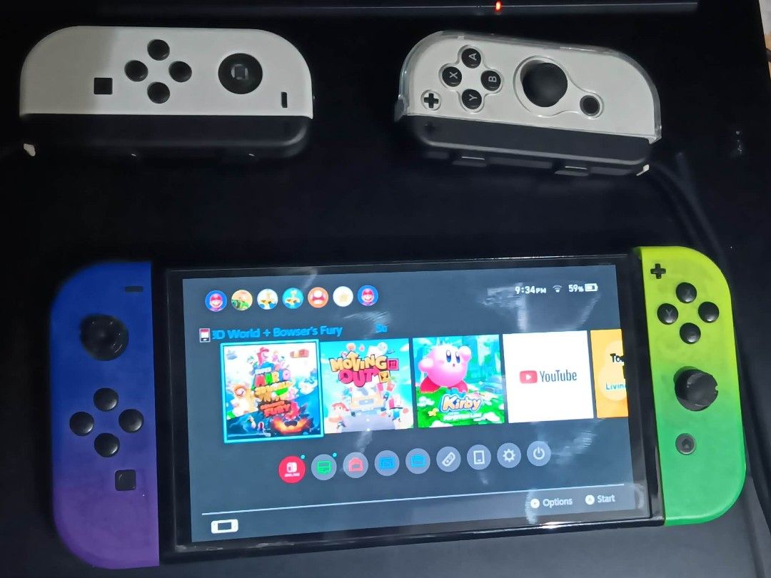 Nintendo Switch OLED with 256gb. Mem card (Category: Nintendo) located in Manila. Submitted by johann1420 (Listing ID 1461949720, Image 3). Description: - Nintendo Switch Console - Unique Green & Purple Gradient Joy-Cons - Includes 2 White Joy-Con Grips - Games Included: Mario Kart 8 Deluxe, Super Mario Party, Super Mario 3D World + Bowser's Fury, Kirby and the Forgotten Land, Minecraft - Ideal for both home and on-the-go gaming issues: controlle