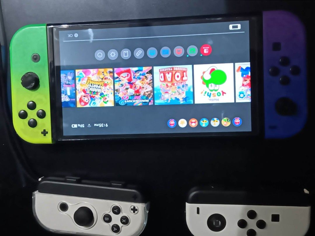 Nintendo Switch OLED with 256gb. Mem card (Category: Nintendo) located in Manila. Submitted by johann1420 (Listing ID 1461949720, Image 1). Description: - Nintendo Switch Console - Unique Green & Purple Gradient Joy-Cons - Includes 2 White Joy-Con Grips - Games Included: Mario Kart 8 Deluxe, Super Mario Party, Super Mario 3D World + Bowser's Fury, Kirby and the Forgotten Land, Minecraft - Ideal for both home and on-the-go gaming issues: controlle