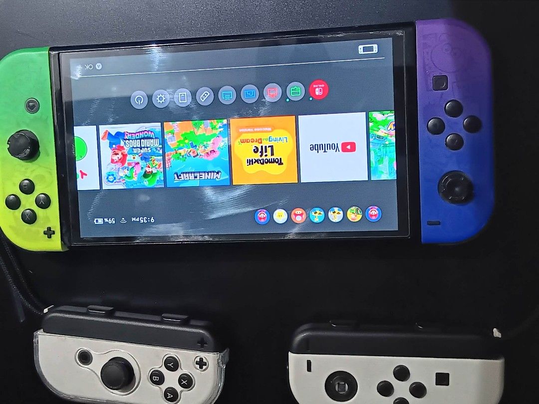 Nintendo Switch OLED with 256gb. Mem card (Category: Nintendo) located in Manila. Submitted by johann1420 (Listing ID 1461949720, Image 2). Description: - Nintendo Switch Console - Unique Green & Purple Gradient Joy-Cons - Includes 2 White Joy-Con Grips - Games Included: Mario Kart 8 Deluxe, Super Mario Party, Super Mario 3D World + Bowser's Fury, Kirby and the Forgotten Land, Minecraft - Ideal for both home and on-the-go gaming issues: controlle