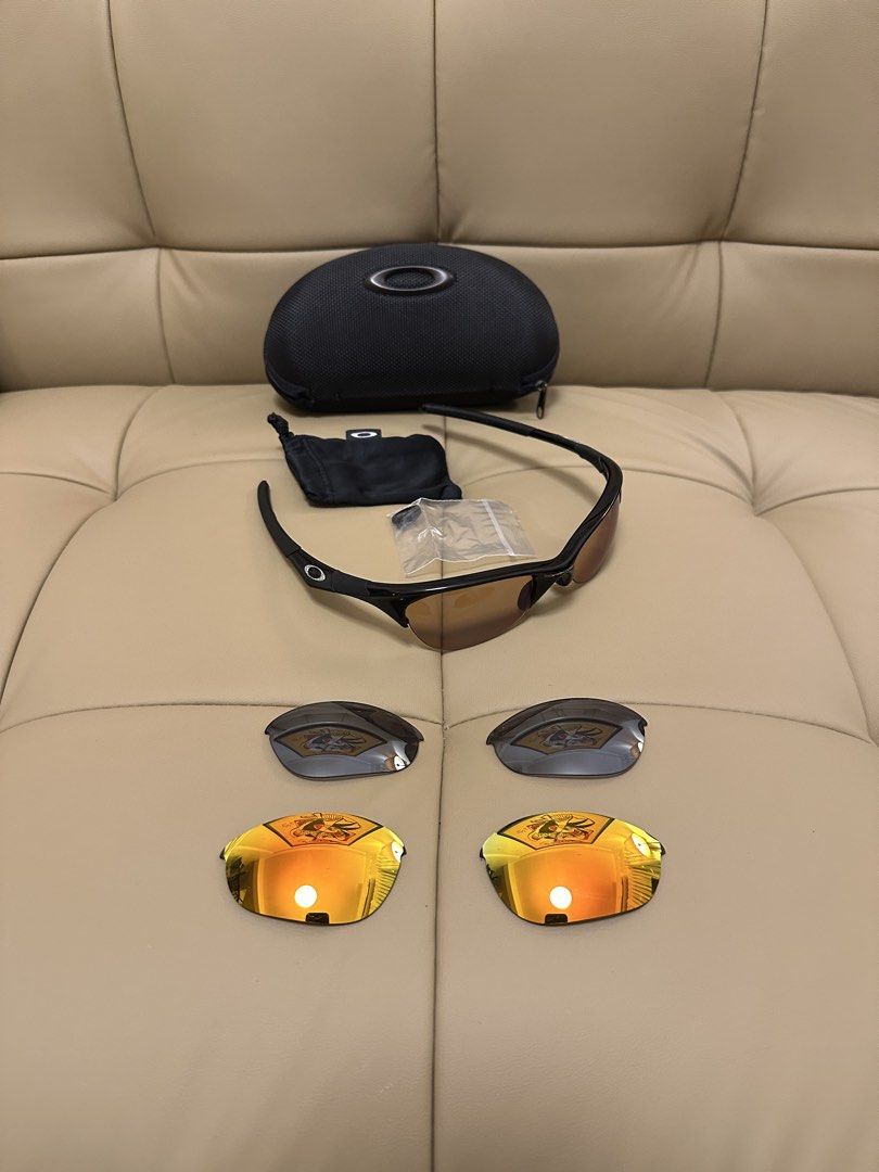 Oakley Half Jacket 1.0 Sunglasses with Multiple Lenses and Case (Category: Sunglasses & Eyewear) located in Quezon City. Submitted by mancave_stuff (Listing ID 1461798310, Image 1). Description: - Authentic Oakley Half jacket 1.0 sunglasses -Deadstock - Stealth black frame with silver O and versatile brown lenses - Comes with protective hard case,soft pouch and spare nose pads. - Includes 3 pairs of multiple interchangeable lenses for various lig