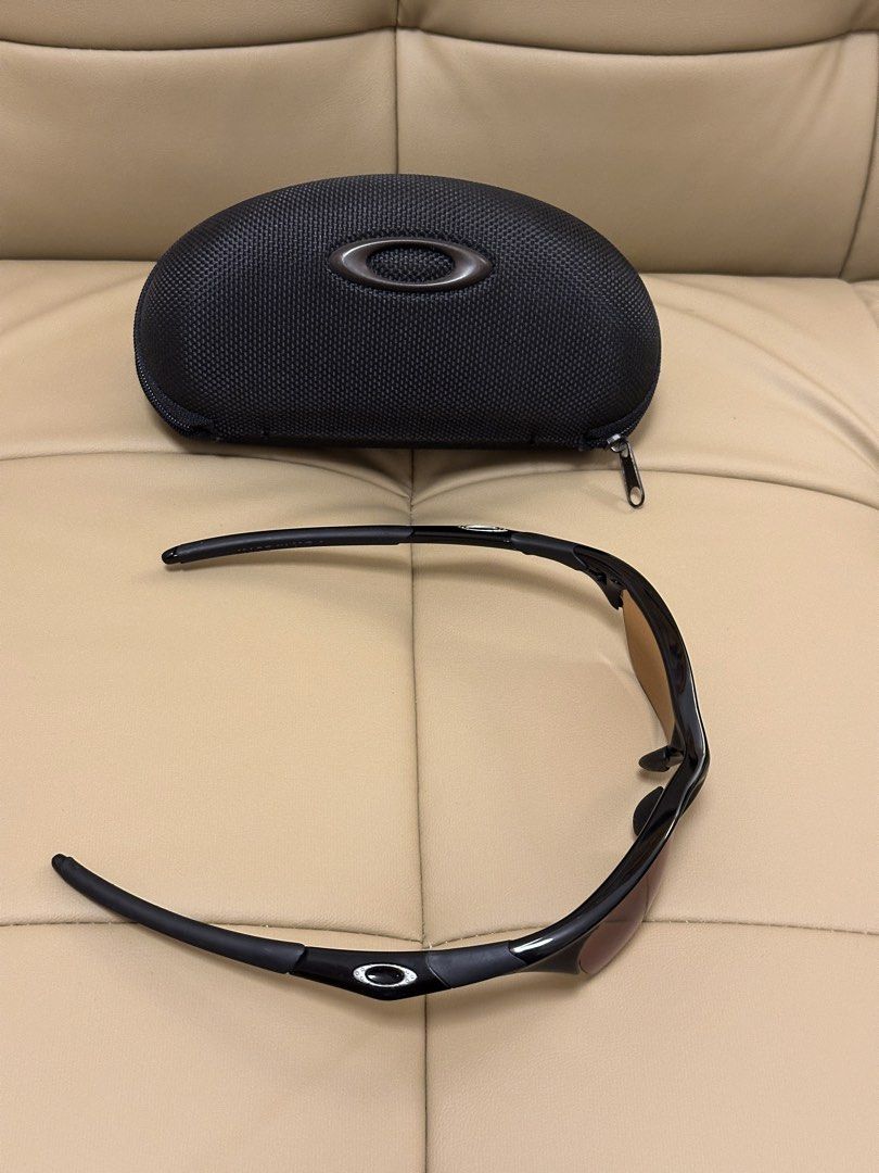 Oakley Half Jacket 1.0 Sunglasses with Multiple Lenses and Case (Category: Sunglasses & Eyewear) located in Quezon City. Submitted by mancave_stuff (Listing ID 1461798310, Image 3). Description: - Authentic Oakley Half jacket 1.0 sunglasses -Deadstock - Stealth black frame with silver O and versatile brown lenses - Comes with protective hard case,soft pouch and spare nose pads. - Includes 3 pairs of multiple interchangeable lenses for various lig