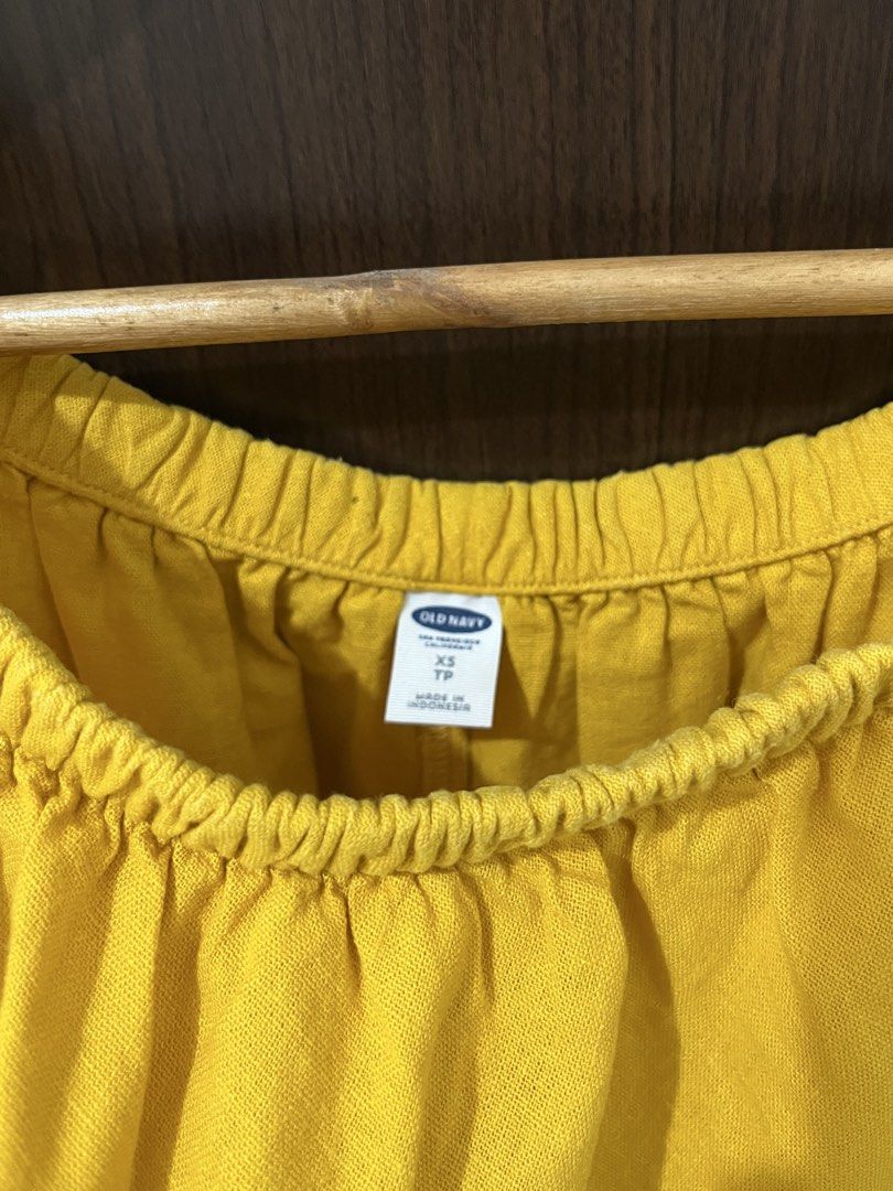 Old Navy Yellow Off-Shoulder Dress (Category: Dresses) located in Manila. Submitted by mentone (Listing ID 1461853556, Image 3). Description: - Yellow off-shoulder dress - Brand: Old Navy - Ruffled overlay at the bust - Elasticated neckline for a comfortable fit - Short sleeves - Ideal for casual outings or beach days.