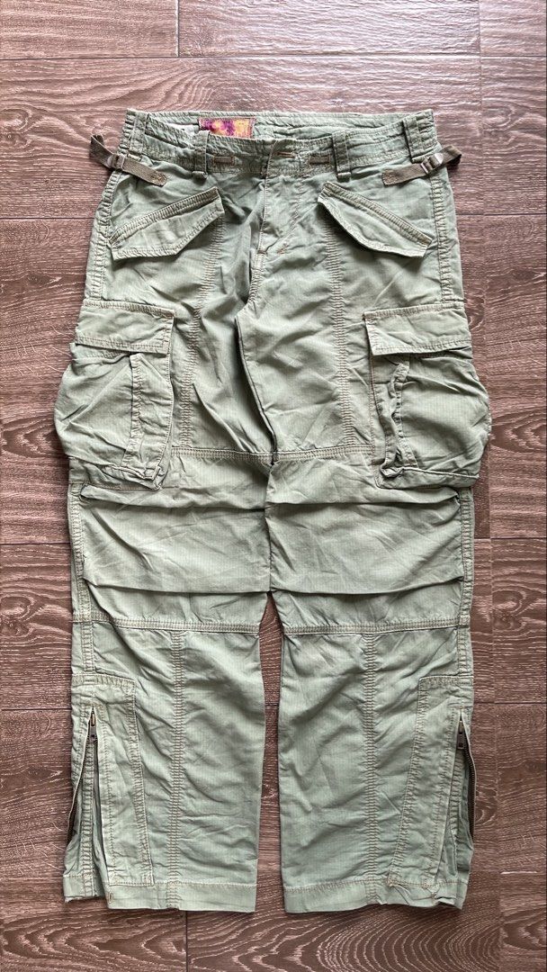 Olive Green Cargo Pants with Multiple Pockets (Category: Activewear) located in Baguio. Submitted by dutefinds (Listing ID 1461856435, Image 3). Description: Y2k Salad cargo pants olive green Very nice quality Check when worn pics for actual color - Waist- 28”-30” Length- 38 Leg opening- 9 Waist can be adjusted, model is 24” waist .