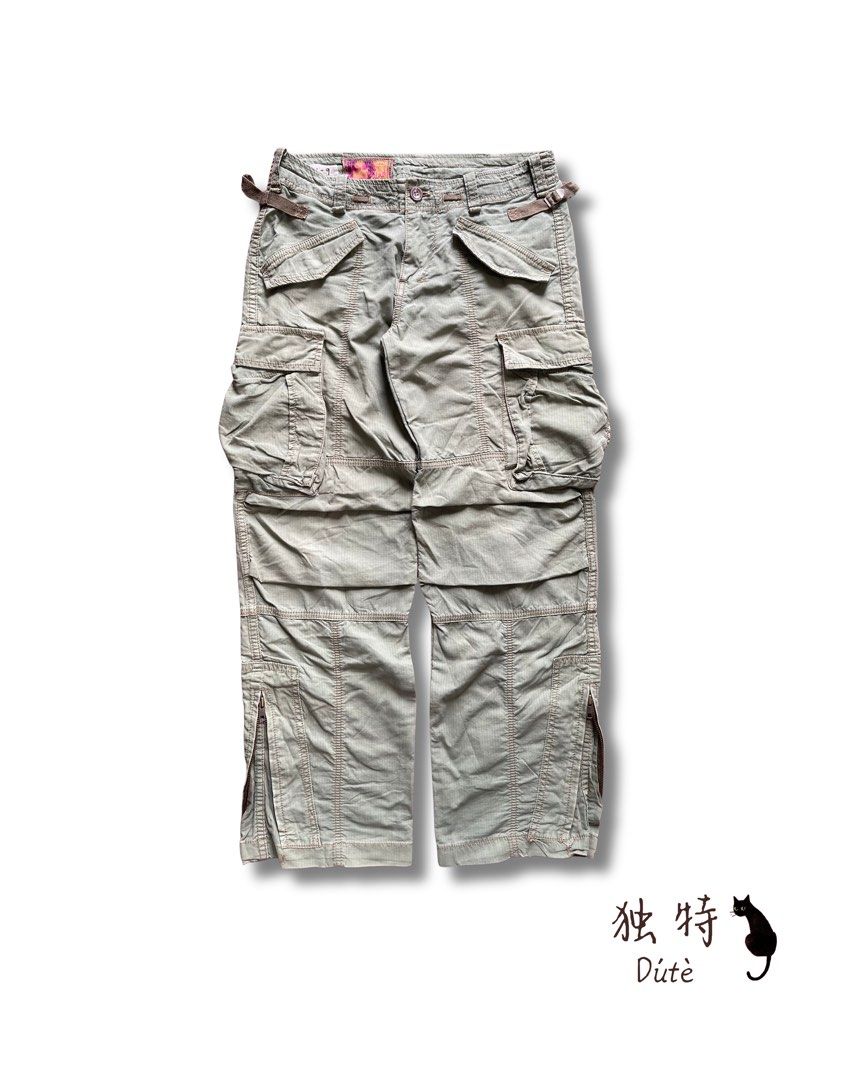 Olive Green Cargo Pants with Multiple Pockets (Category: Activewear) located in Baguio. Submitted by dutefinds (Listing ID 1461856435, Image 2). Description: Y2k Salad cargo pants olive green Very nice quality Check when worn pics for actual color - Waist- 28”-30” Length- 38 Leg opening- 9 Waist can be adjusted, model is 24” waist .
