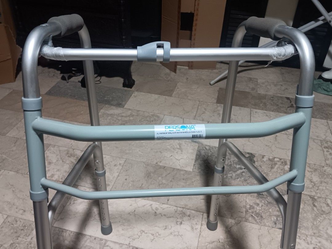 Persona Aluminum Walker with Wheels (Category: Infant Playtime) located in Las Pinas. Submitted by jesus1smysavi0r (Listing ID 1461943222, Image 1). Description: - Persona aluminum walker with wheels - Lightweight and easy to maneuver - Adjustable height for customized fit - Provides excellent mobility assistance - Minor scuff marks on wheels from normal use - Ready for its next owner.