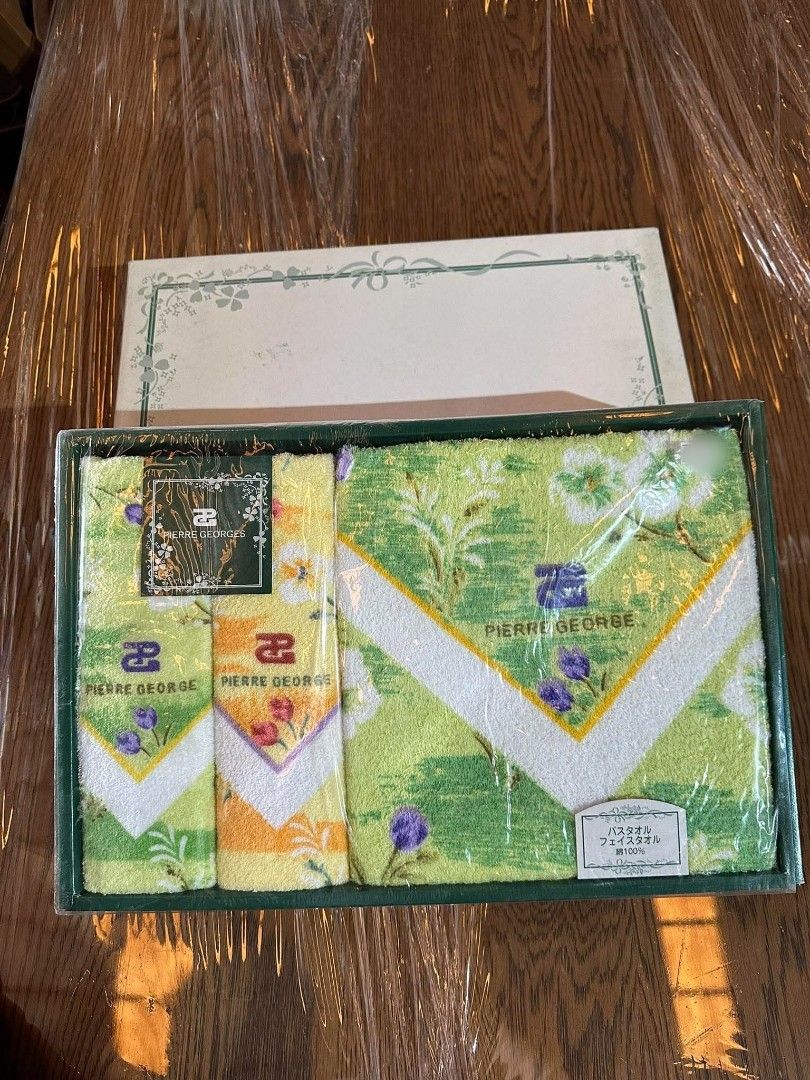 Pierre George Bath and Face Towel Set (Category: Bedding & Towels) located in Bulacan. Submitted by hunterherojapanjdm (Listing ID 1461834826, Image 1). Description: - Set includes 1 bath towel and 2 face towels. - Brand: Pierre George - Material: 100% Cotton - Design: Green and yellow floral pattern with purple accents - Condition: Brand new, in original packaging.
