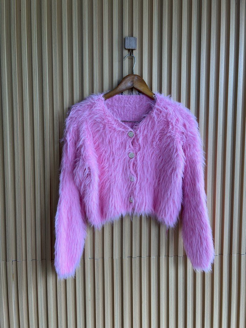 Pink Fuzzy Cropped Cardigan (Category: Coats, Jackets and Outerwear) located in Lipa City. Submitted by thyra06 (Listing ID 1461966021, Image 2). Description: - Super cute pink fuzzy cropped cardigan - Button-up front - Soft and fluffy texture - Ideal for layering over tops or dresses - Adds a pop of color to any outfit - Perfect for a fun, playful look.