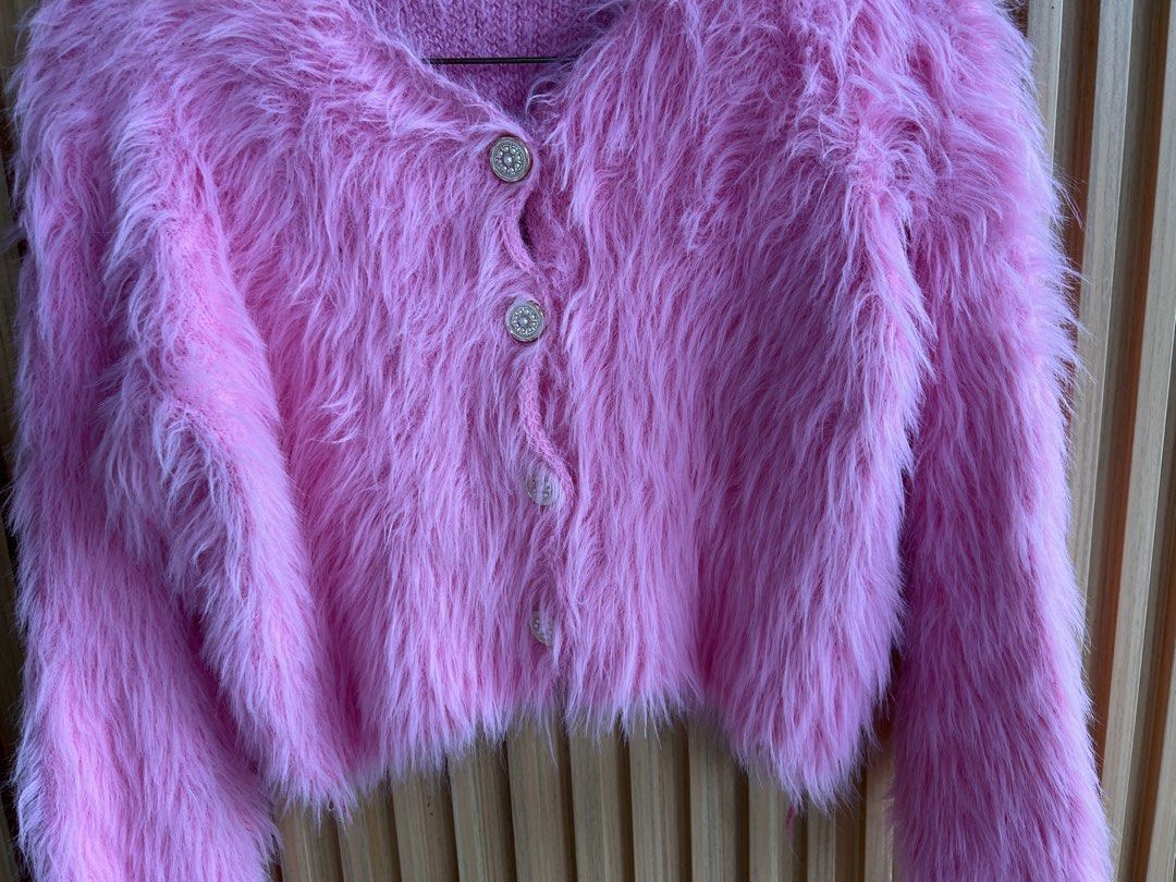 Pink Fuzzy Cropped Cardigan (Category: Coats, Jackets and Outerwear) located in Lipa City. Submitted by thyra06 (Listing ID 1461966021, Image 3). Description: - Super cute pink fuzzy cropped cardigan - Button-up front - Soft and fluffy texture - Ideal for layering over tops or dresses - Adds a pop of color to any outfit - Perfect for a fun, playful look.