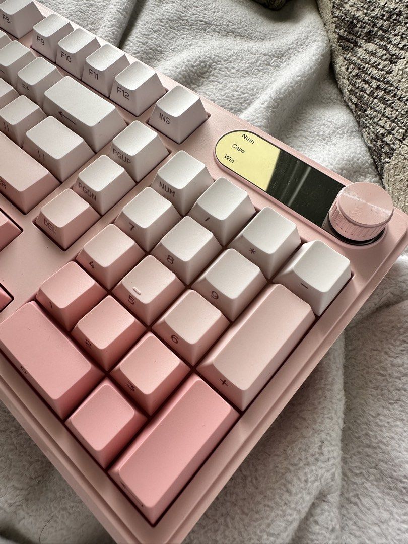 Pink Gradient Membrane Keyboard with USB-C (Category: Computer Keyboard) located in Las Pinas. Submitted by dindin_gallardo (Listing ID 1461844726, Image 3). Description: - Stunning pink gradient design - Full numpad for productivity - Convenient rotary knob for controls - Wired USB-C connection (cable included) - Ideal for both gaming and typing - Enhances your desk setup with its aesthetic appeal.