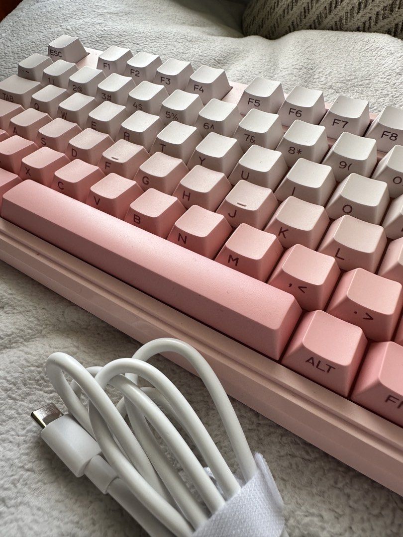 Pink Gradient Membrane Keyboard with USB-C (Category: Computer Keyboard) located in Las Pinas. Submitted by dindin_gallardo (Listing ID 1461844726, Image 2). Description: - Stunning pink gradient design - Full numpad for productivity - Convenient rotary knob for controls - Wired USB-C connection (cable included) - Ideal for both gaming and typing - Enhances your desk setup with its aesthetic appeal.