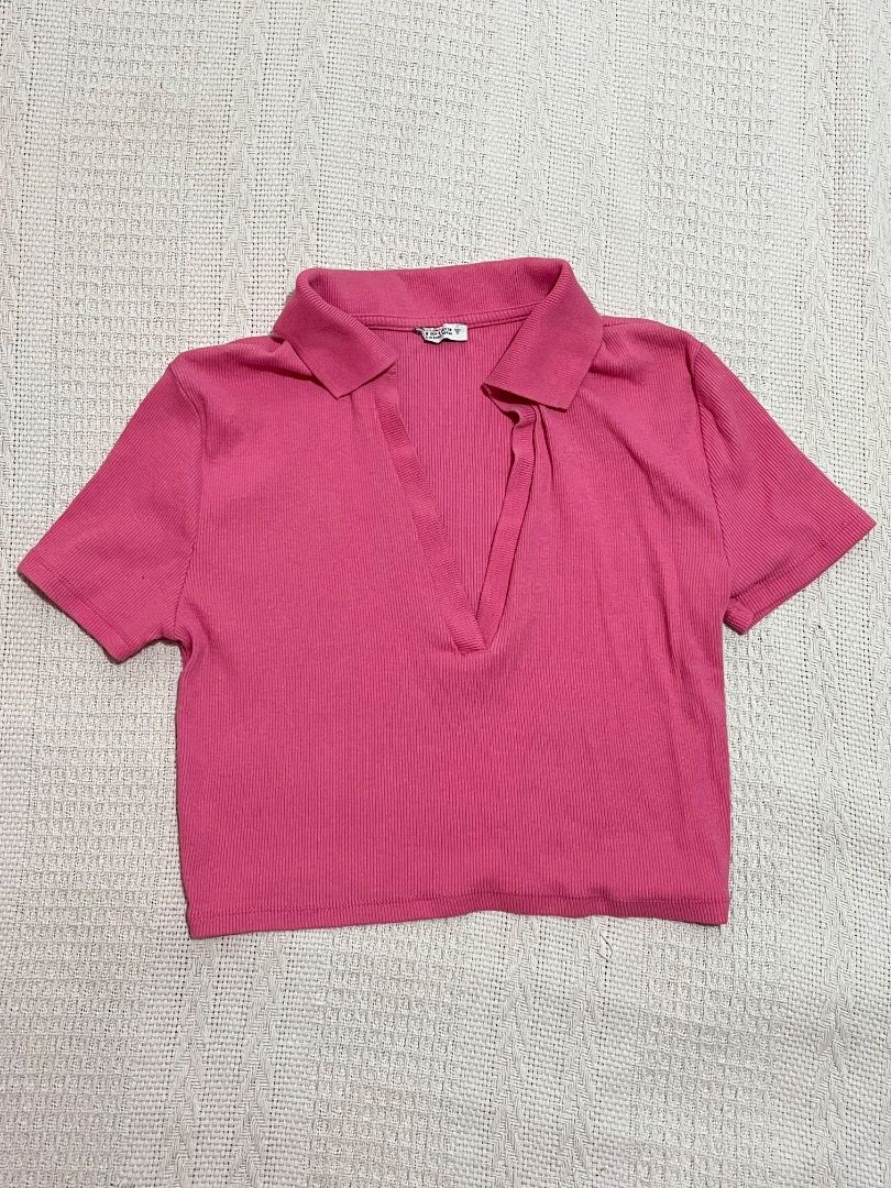 Pink Ribbed Cropped Polo Shirt (Category: Shirts) located in Santa Rosa. Submitted by rsxyen (Listing ID 1461940291, Image 1). Description: - Cute pink cropped polo shirt - Ribbed texture all over - Short sleeves - Collar with V-neck opening - Versatile for casual or dressed-up outfits - Pairs well with high-waisted jeans or skirts.