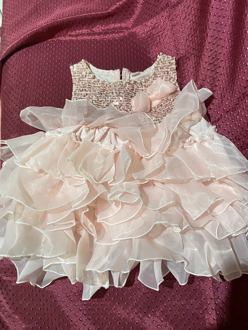 Pink Ruffled Dress with Sequined Bodice (Category: Babies & Kids Fashion) located in Manila. Submitted by boss_madam (Listing ID 1461996267, Image 2). Description: Cute pink party dress for girls! Sparkly sequins, ruffles, and a matching bow. Zipper back. .