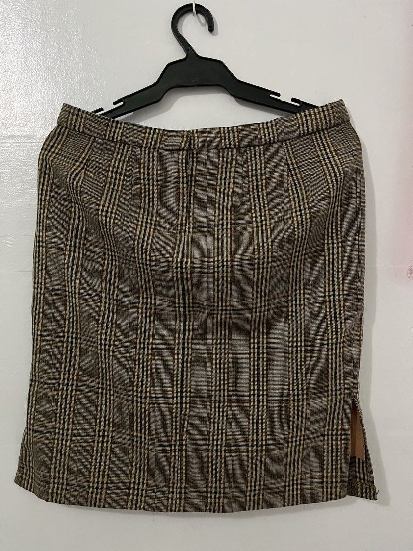 Plaid Pencil Skirt with Side Slit (Category: Skirts) located in Antipolo. Submitted by starraid777 (Listing ID 1461844919, Image 3). Description: - Classic brown and beige plaid pencil skirt - Features a subtle side slit - Timeless cut, ideal for work or smart casual outfits - Versatile: easily pairs with blouses or sweaters.