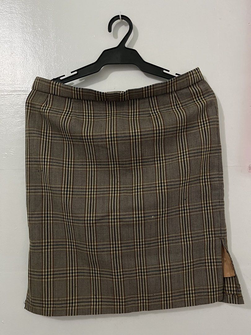Plaid Pencil Skirt with Side Slit (Category: Skirts) located in Antipolo. Submitted by starraid777 (Listing ID 1461844919, Image 2). Description: - Classic brown and beige plaid pencil skirt - Features a subtle side slit - Timeless cut, ideal for work or smart casual outfits - Versatile: easily pairs with blouses or sweaters.