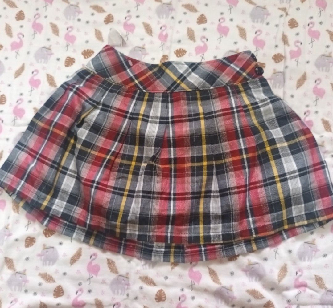 Plaid Pleated Skirt (Category: Skirts) located in Pasig City. Submitted by zeallion_149f0e (Listing ID 1461891097, Image 1). Description: - Adorable plaid skirt in red, black, white, and yellow. - Features a stylish all-around pleated design. - Two button details at the waistband for a secure fit. - Versatile for preppy or casual looks. - Effortlessly pairs with various tops..