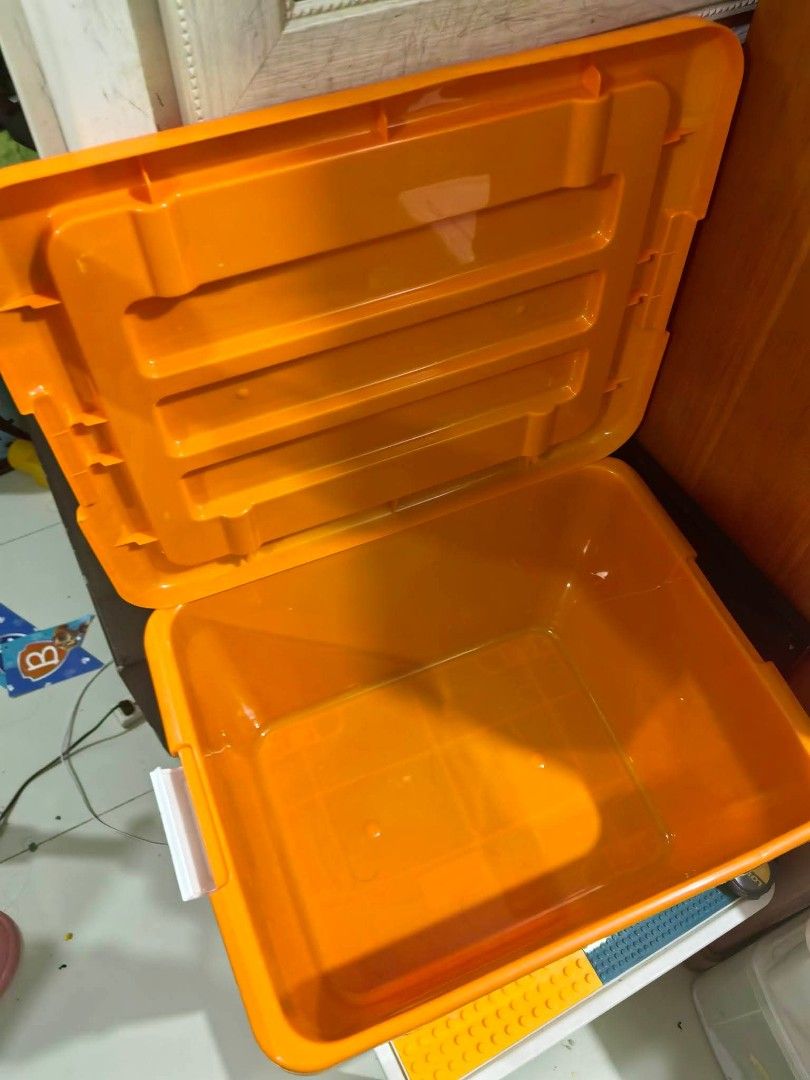 Plastic Storage Box - with Wheels. (Category: Storage Boxes & Baskets) located in Cebu City. Submitted by dudes_villanueva (Listing ID 1461817508, Image 3). Description: Plastic Storage Box - Orange Top Lid with Wheels. 📌 In excellent condition. L19.75xW15.5xH13 in.