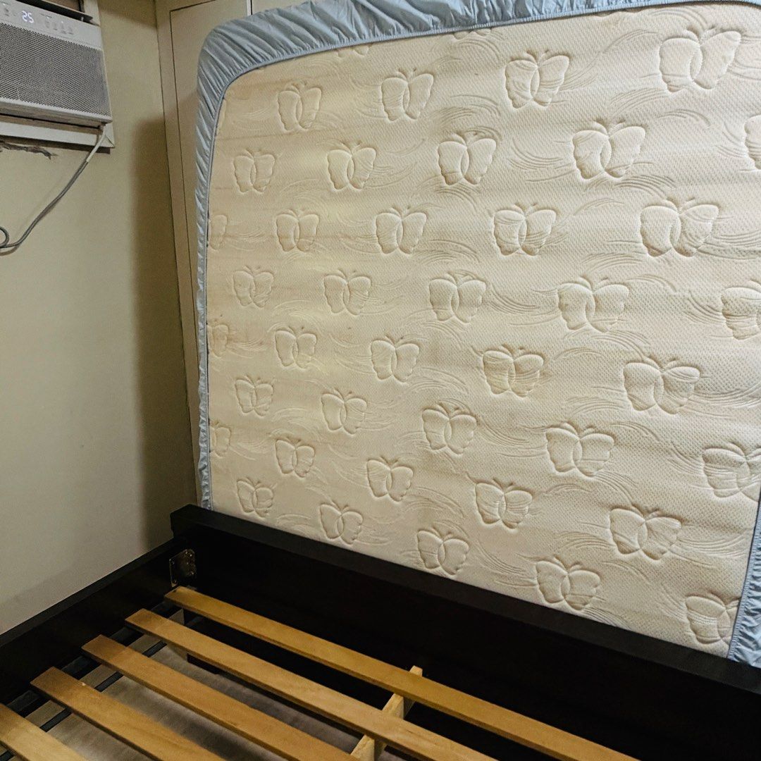 Platform Bed Frame and Mattress (Category: Bed Frames & Mattresses) located in Mandaluyong City. Submitted by jed117 (Listing ID 1461932087, Image 2). Description: - Complete Bed Set: Includes mattress and bed frame. - Mattress: Ambassador Pocket Ortho Reflex with a unique butterfly pattern. - Bed Frame: Dark wood, sturdy, and modern platform design. - Selling as a complete set. - Price P10,000 - Send a Direct Message (DM) for more details. 09285