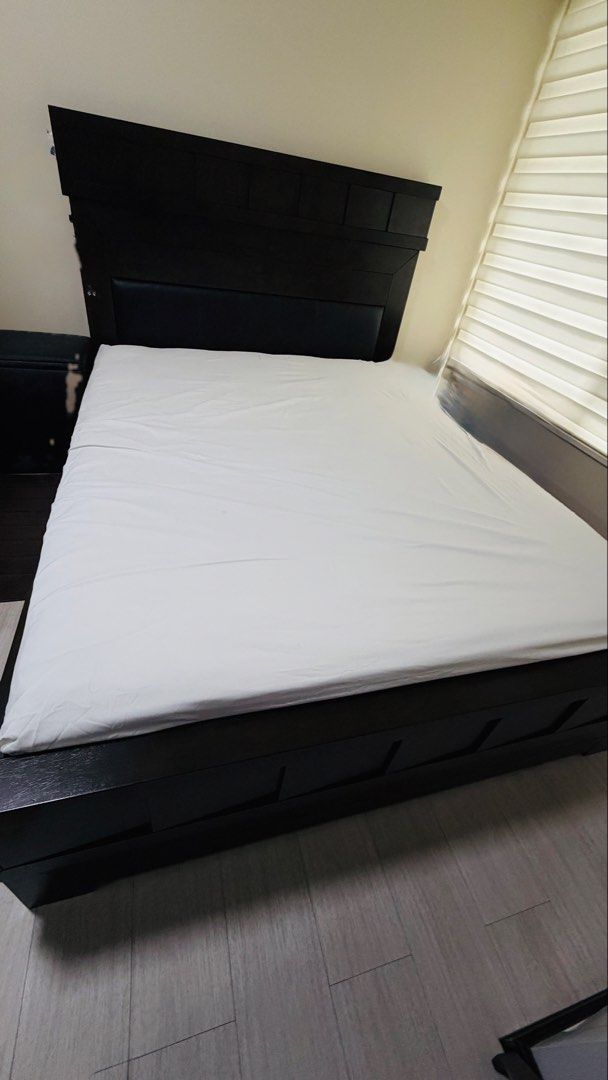 Platform Bed Frame and Mattress (Category: Bed Frames & Mattresses) located in Mandaluyong City. Submitted by jed117 (Listing ID 1461932087, Image 3). Description: - Complete Bed Set: Includes mattress and bed frame. - Mattress: Ambassador Pocket Ortho Reflex with a unique butterfly pattern. - Bed Frame: Dark wood, sturdy, and modern platform design. - Selling as a complete set. - Price P10,000 - Send a Direct Message (DM) for more details. 09285