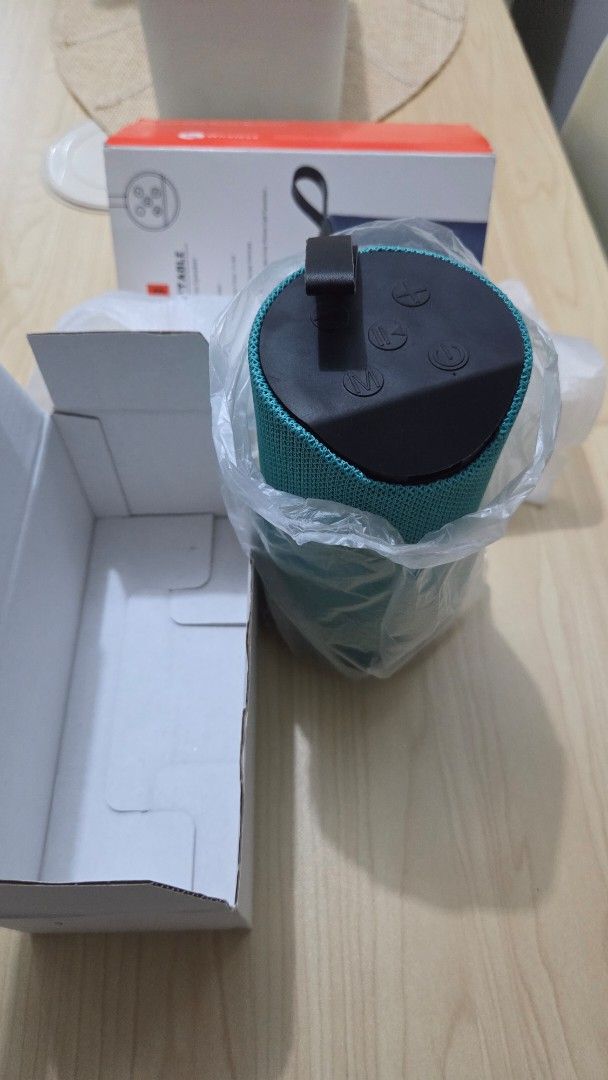 Portable Wireless Speaker with USB Playback and Splashproof (Category: Soundbars, Speakers & Amplifiers) located in Quezon City. Submitted by donbarero (Listing ID 1461823459, Image 2). Description: - Teal portable wireless speaker - Play music via Bluetooth - USB playback function - Built-in mic for hands-free calls - Splashproof design - 3-4 hours playing time - Comes with original box and packaging.