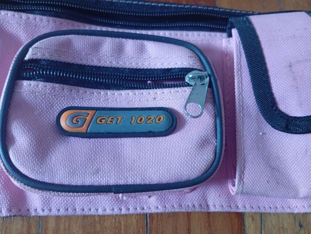 Pouch (Category: Purses & Pouches) located in Singapore. Submitted by crisis7979 (Listing ID 1461811413, Image 3). Description: - Pink pouch - Multiple zippered compartments - Front pocket - Adjustable strap.