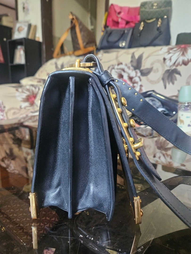 Prada (Category: Luxury Bags & Wallets) located in Zamboanga. Submitted by clayd052 (Listing ID 1461960025, Image 3). Description: issue. - obviously the front letters are missing.the P R A and M the bag is in good condition.