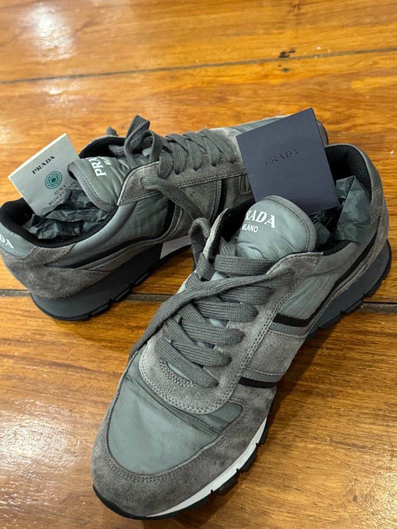 Prada Grey Suede Sneakers (Category: Sneakers & Footwear) located in Pasig City. Submitted by suameiko (Listing ID 1461974439, Image 1). Description: - Grey Prada sneakers - Suede material - Includes authenticity card and original dustbag - Negotiable.