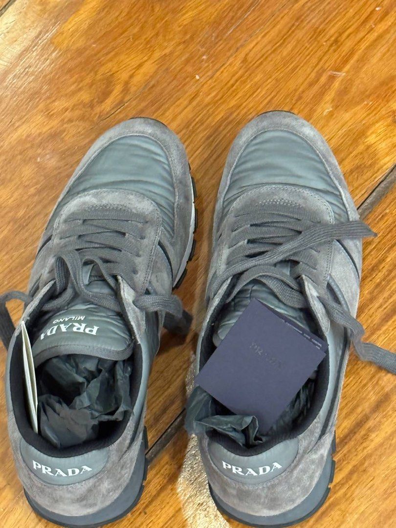 Prada Grey Suede Sneakers (Category: Sneakers & Footwear) located in Pasig City. Submitted by suameiko (Listing ID 1461974439, Image 2). Description: - Grey Prada sneakers - Suede material - Includes authenticity card and original dustbag - Negotiable.