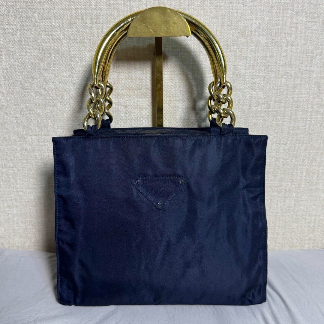PRADA HANDBAG NYLON (Category: Luxury Bags & Wallets) located in Claveria. Submitted by jhunaceeeeee (Listing ID 1461811428, Image 1). Description: 💯Authentic Missing front logo Good as new Bag only.