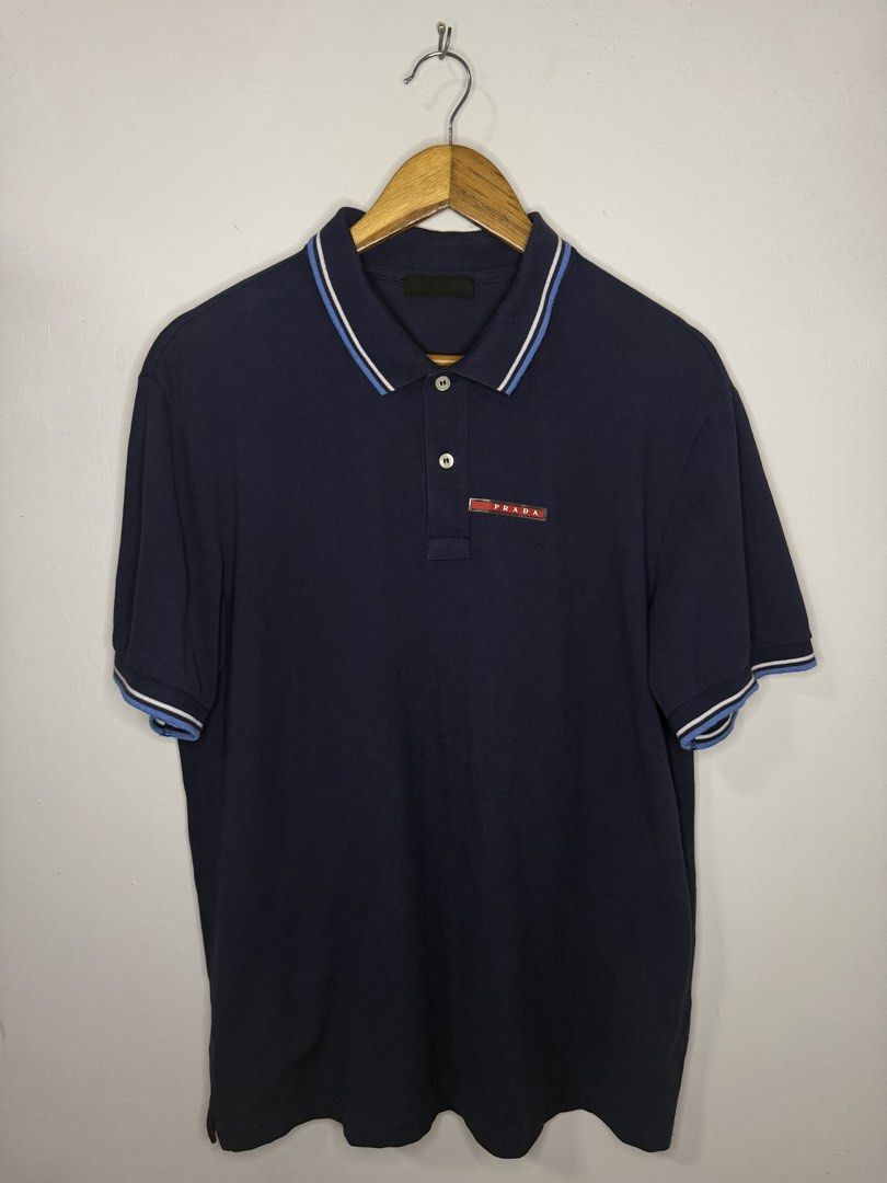 Prada Polo Shirt (Dark Blue) (Category: Luxury Apparel) located in Manila. Submitted by jcarchives14 (Listing ID 1461856181, Image 1). Description: Prada Polo Shirt Dark Blue Size XXL Excellent condition Php3,000 Message me for more details 🔑.