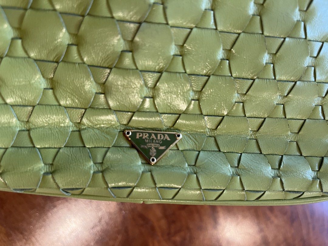 Prada Woven Leather Shoulder Bag (Category: Luxury Bags & Wallets) located in Makati City. Submitted by apwellloved (Listing ID 1461802991, Image 3). Description: - Authentic Vintage Prada olive woven/mosaic leather shoulder bag - Features the iconic Prada triangle logo - Stylish chain strap - Overall, a great bag despite minor wear.