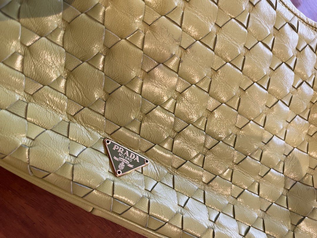 Prada Woven Leather Shoulder Bag (Category: Luxury Bags & Wallets) located in Makati City. Submitted by apwellloved (Listing ID 1461802991, Image 2). Description: - Authentic Vintage Prada olive woven/mosaic leather shoulder bag - Features the iconic Prada triangle logo - Stylish chain strap - Overall, a great bag despite minor wear.