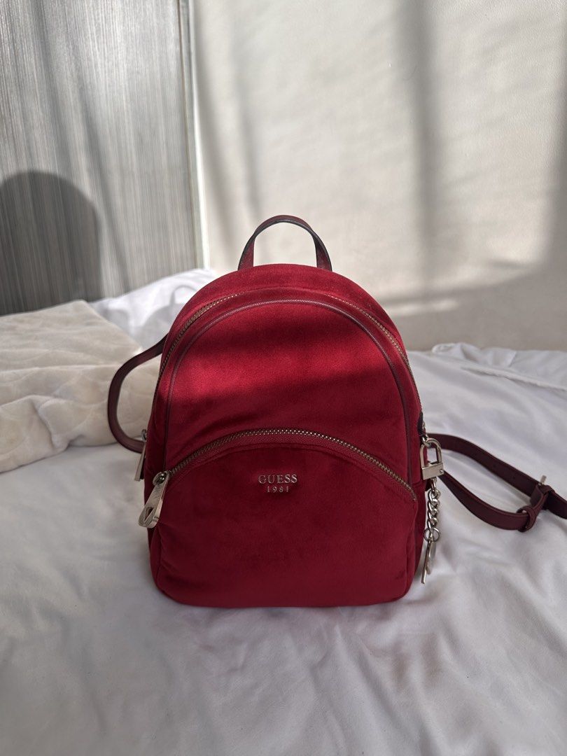 Preloved Guess Red Suede Mini Backpack (Category: Backpacks) located in Manila. Submitted by kaisrmnt (Listing ID 1461894934, Image 1). Description: super cute mini backpack negotiable please note issues: (see pics for reference) slight surface scratches on hardware, slightly tarnished hardware, straps shows signs of wear, with cracking and some chipping/peeling of the outer material, inner lining has some discoloration from use rfs: decluttering