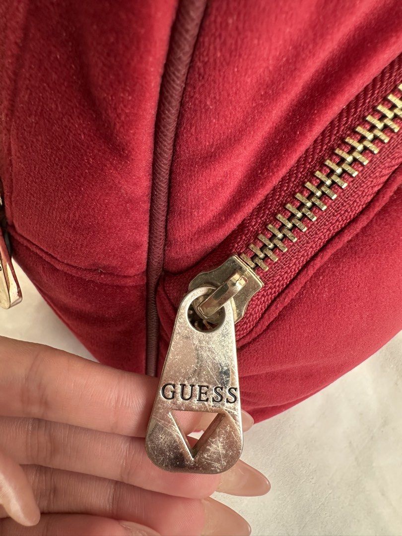 Preloved Guess Red Suede Mini Backpack (Category: Backpacks) located in Manila. Submitted by kaisrmnt (Listing ID 1461894934, Image 3). Description: super cute mini backpack negotiable please note issues: (see pics for reference) slight surface scratches on hardware, slightly tarnished hardware, straps shows signs of wear, with cracking and some chipping/peeling of the outer material, inner lining has some discoloration from use rfs: decluttering