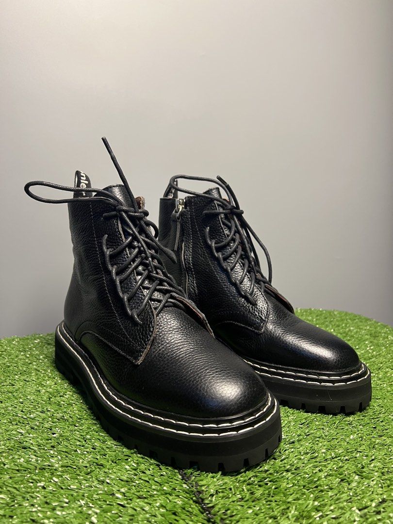 PROENZA SCHOULER - BLACK LUG COMBAT BOOTS (Category: Sneakers & Footwear) located in Bacolod City. Submitted by timelessbyjosh (Listing ID 1461967224, Image 1). Description: BEST FOR CASUAL & AVANT GARDE OUTFITS SIZE : 36 ACTUAL COLOR : BLACK & WHITE COLOR RATE : 10 OUT OF 10 CONDITION : EXCELLENT MATERIAL : MADE IN : ITALY FLAWS : TEAR ON THE SHOELACE AND SIGN OF USAGE ( SEE LAST PHOTO FOR REFERENCE ) “ UNNOTICEABLE & REPLACEABLE “ DIMENSIONS OU