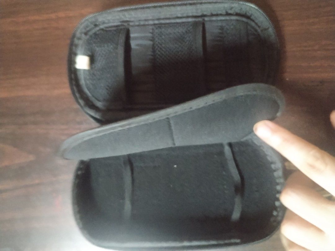 PSP Black Case (Category: Storage Boxes & Baskets) located in Manila. Submitted by patrickdeclutters (Listing ID 1461868434, Image 2). Description: - Durable black hard shell case - Ideal for small electronics and accessories - Secure zipper closure - Internal elastic straps to keep items in place - Includes a metal carabiner clip for easy attachment - Great for travel and everyday organization.