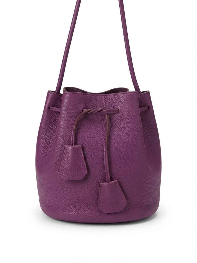 Purple Leather Drawstring Bucket Bag (Category: Cross-body Bags) located in Cavite. Submitted by bags_unltd143 (Listing ID 1461836880, Image 1). Description: Purple leather bucket bag. Drawstring closure. Has two small leather tassels. The base measures 18cm across. The height is 21cm. Great for everyday use..