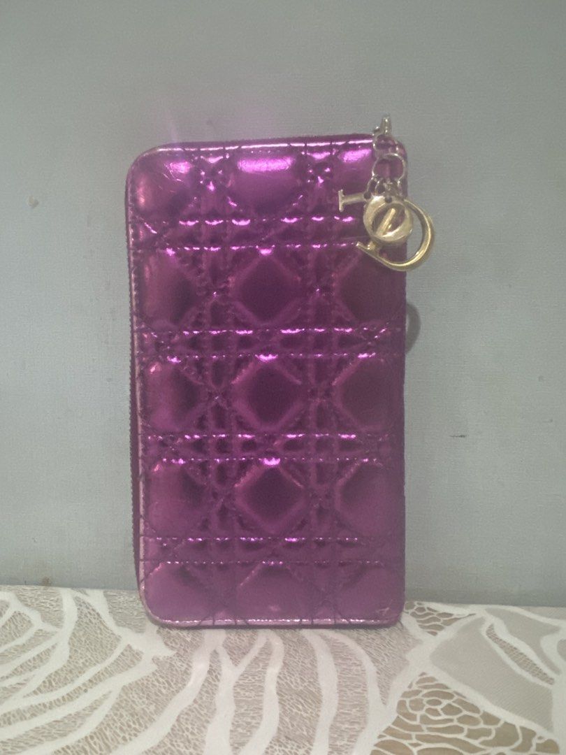 Purple Metallic Quilted Zip Around Wallet (Category: Wallets & Card holders) located in Cagayan de Oro. Submitted by ericlarkyl89146 (Listing ID 1461850285, Image 2). Description: - Stylish purple metallic wallet - Elegant quilted design - Secure zip-around closure - Ample card slots and compartments for organization - Adorable charm attached to the zipper - Ideal for everyday use and keeping essentials tidy.