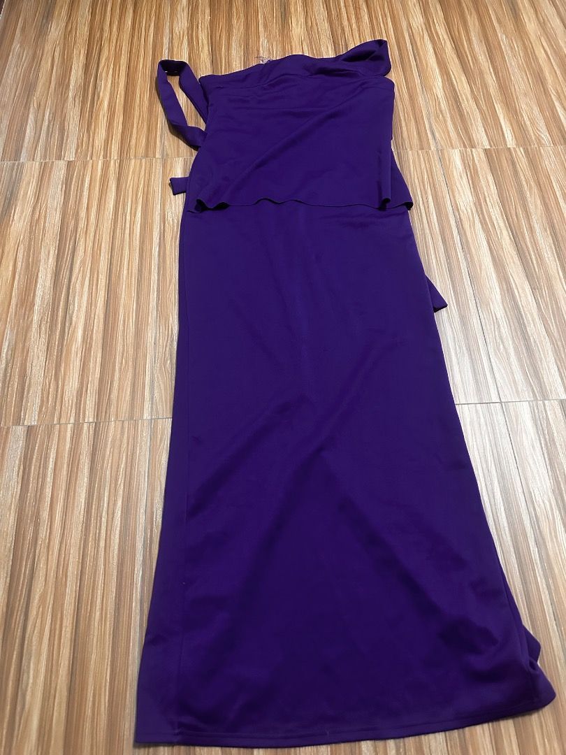 Purple One-Shoulder Maxi Dress (Category: Dresses) located in Quezon City. Submitted by goldencrystal_69274d (Listing ID 1461879371, Image 1). Description: - Stunning one-shoulder maxi dress in a vibrant purple hue. - Elegant ruffled detail on the top. - Adjustable tie-around strap for a perfect fit. - Long, flowing skirt for a graceful silhouette. - Flattering tie detail at the waist. - Made from comfortable fabric for all-day wear. - Ideal for 