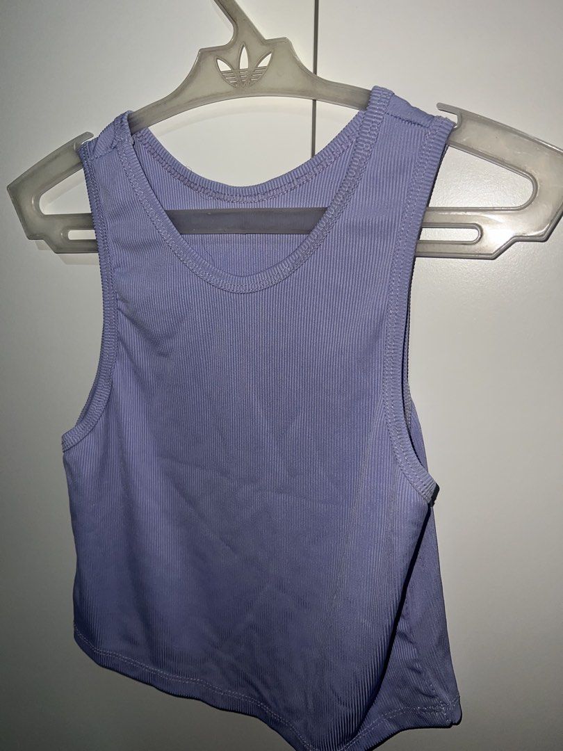 Purple Ribbed Cropped Tank Top (Category: Sleeveless) located in Manila. Submitted by twiicee (Listing ID 1461910691, Image 1). Description: - Purple ribbed cropped tank top - Sleeveless design - Stretchy and comfortable material - Perfect for layering or wearing solo - Easily pairs with jeans or shorts - Ideal for a casual look.