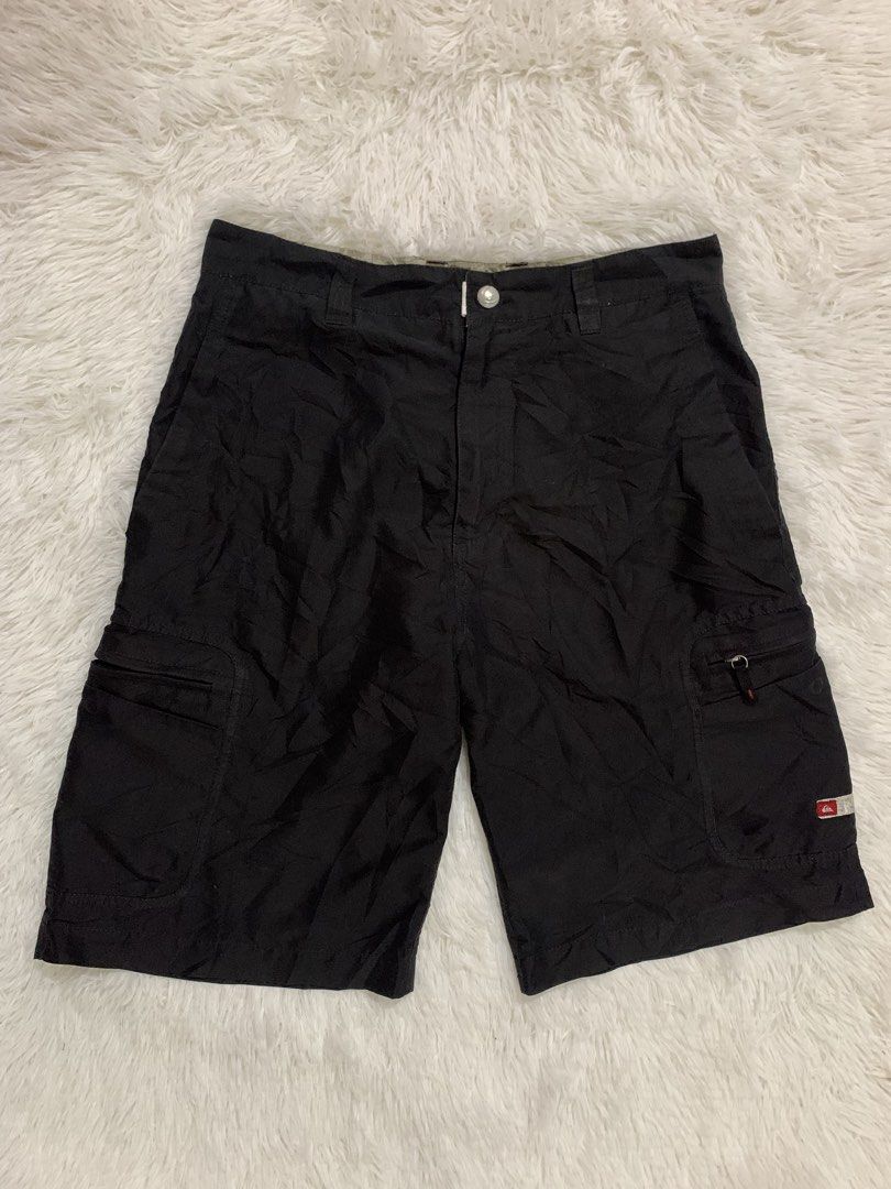Quiksilver Black Cargo Shorts Size 32 (Category: Shorts) located in Iba. Submitted by thriftcoyan (Listing ID 1461830209, Image 1). Description: - Quiksilver Cargo Shorts - Color: Black - Size: 32 -Length 22 -Leg opening 11.5 - Features multiple pockets for ample storage - Ideal for casual wear and outdoor activities - Made with durable material - Ready for a new owner.