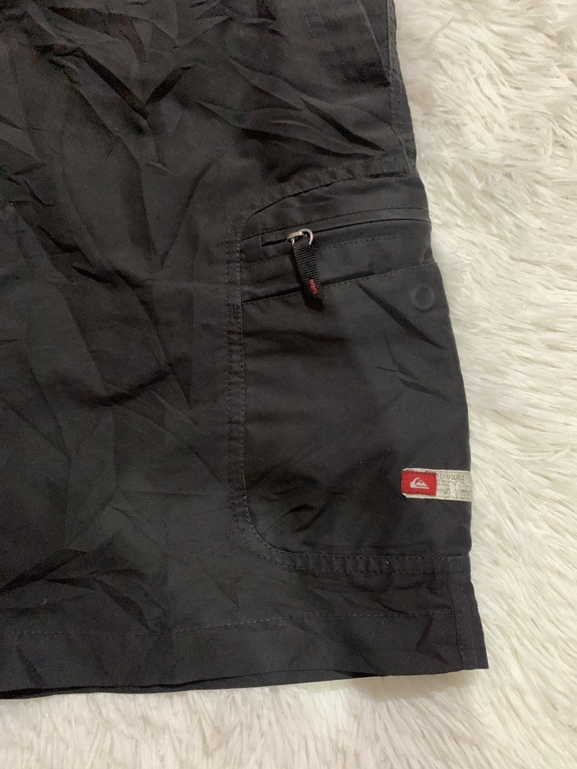 Quiksilver Black Cargo Shorts Size 32 (Category: Shorts) located in Iba. Submitted by thriftcoyan (Listing ID 1461830209, Image 3). Description: - Quiksilver Cargo Shorts - Color: Black - Size: 32 -Length 22 -Leg opening 11.5 - Features multiple pockets for ample storage - Ideal for casual wear and outdoor activities - Made with durable material - Ready for a new owner.
