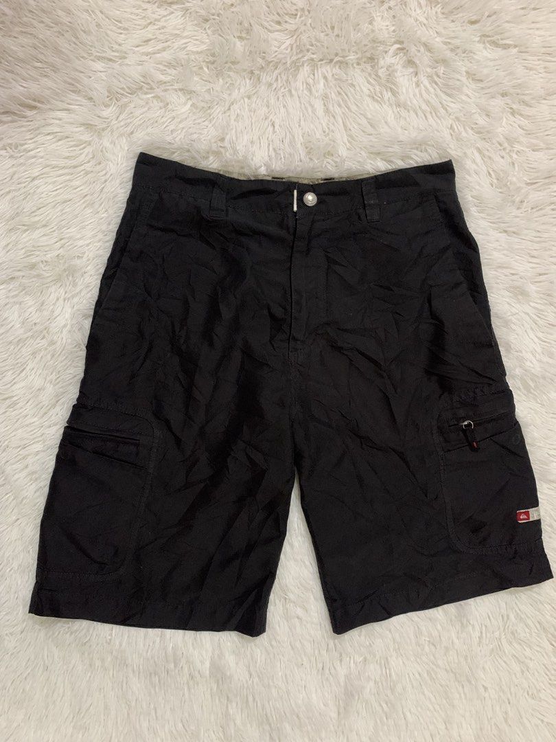 Quiksilver Black Cargo Shorts Size 32 (Category: Shorts) located in Iba. Submitted by thriftcoyan (Listing ID 1461830209, Image 2). Description: - Quiksilver Cargo Shorts - Color: Black - Size: 32 -Length 22 -Leg opening 11.5 - Features multiple pockets for ample storage - Ideal for casual wear and outdoor activities - Made with durable material - Ready for a new owner.