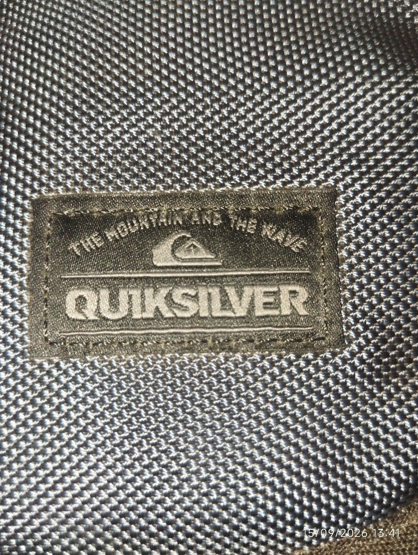 Quiksilver Messenger Bag (Category: Sling Bags) located in Manila. Submitted by thriftjepo01336 (Listing ID 1461887618, Image 2). Description: - Quiksilver messenger bag - Color: Blue with abstract pattern on flap - Features: Main zip compartment, front zip pocket - Adjustable strap for comfortable wear - Ideal for school or everyday use.