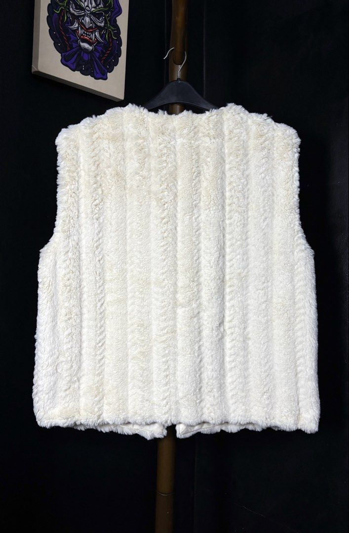 Radarista Fur Vest with Button Closure (Category: Coats, Jackets and Outerwear) located in Bacoor. Submitted by calvinmanzano13 (Listing ID 1461892145, Image 3). Description: - L = 25.5” | W = 23” - Super soft cream faux fur vest - Lined with satin - Two button closures at the front - Ideal for layering in cooler weather - Adds warmth and chic style to any outfit Notes: ☑️ Hand washed ☑️ Polished ☑️ Steam ironed.
