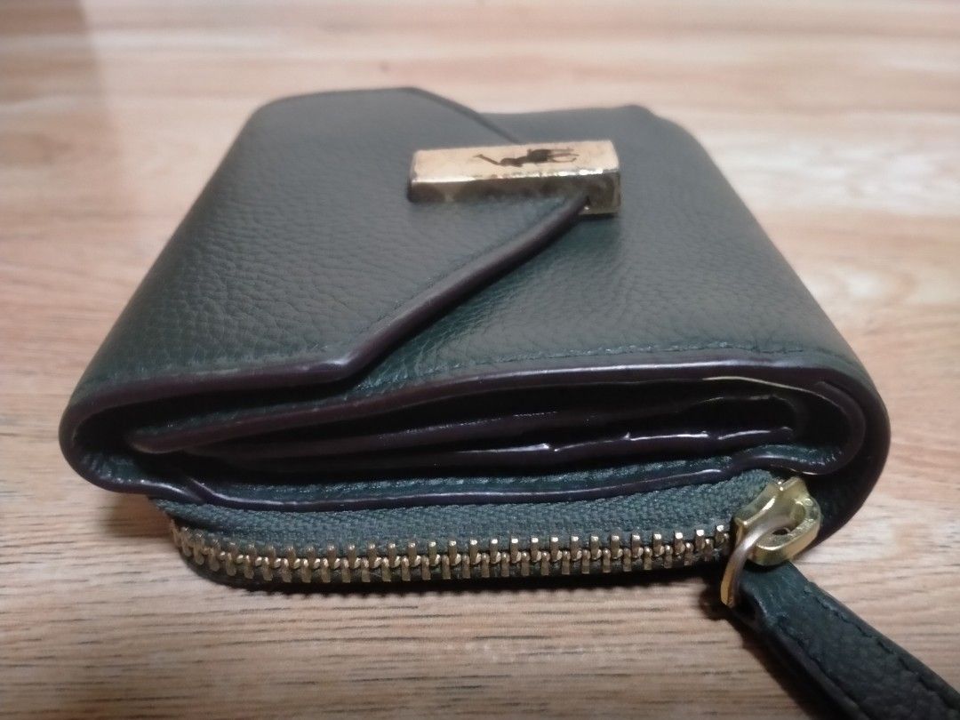 RALPH LAUREN LEATHER COMPACT WALLET (Category: Wallets & Card holders) located in Cabuyao City. Submitted by Bike_Clothing10 (Listing ID 1461814917, Image 3). Description: READ FIRST.... FOR SALE: POLO RALPH LAUREN LEATHER COMPACT WALLET Good Condition With inside tag Legit Dimes: 11.5 x 10 cm NOTE: -Faded/Scratches sa gold logo, kita naman sa pic. -Medjo madumi ung lagayan ng coins. -All in all Good Condition PRICE: 3K Free Shipping (J&T) -NO CO